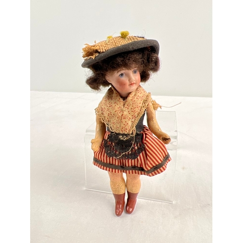 1282 - An antique 5 inch Unis of Paris French bisque head doll in a cotton dress and straw hat. Composite b... 