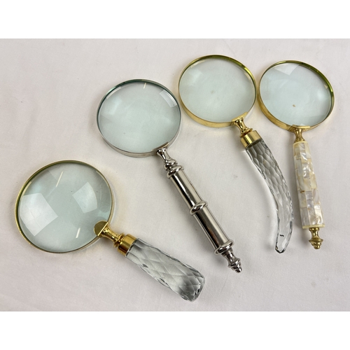 1330 - 4 large magnifying glasses to include faceted glass handled, brass handled set with pearl, and silve... 