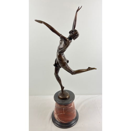 1331 - After Bruno Zach - an Art Deco style bronze figurine of a dancing girl, raised on a conical shaped m... 