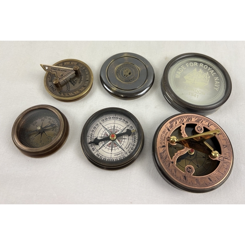 1332 - 3 metal cased naval compasses. A small brass cased compass with folding sundial screw top lid (appro... 