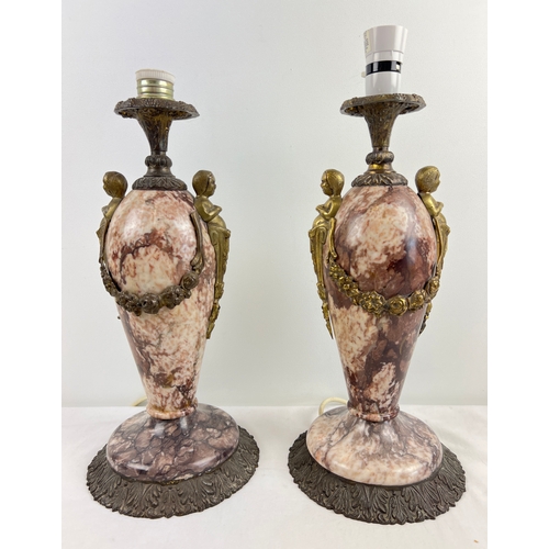 1335 - A pair of heavy 19th century French marble and cast metal urn style table lamps. Cherub and swag met... 