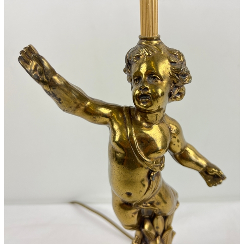 1336 - A vintage French gilt cast metal cherub table lamp. With stepped style base and floral detail. Appro... 