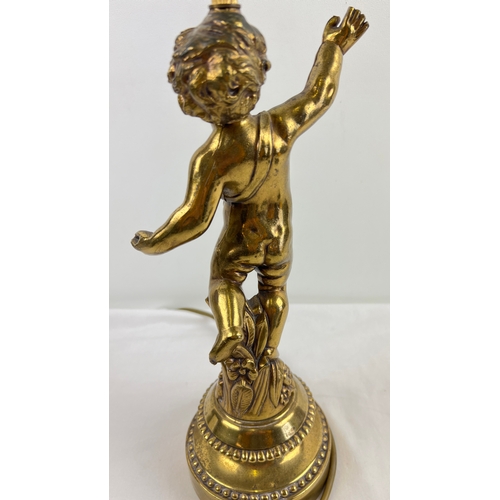 1336 - A vintage French gilt cast metal cherub table lamp. With stepped style base and floral detail. Appro... 