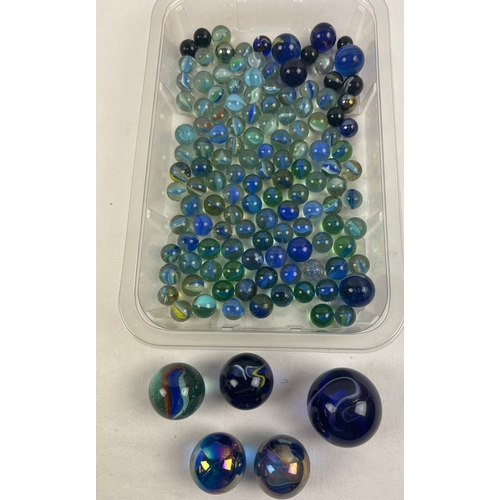 1281 - A collection of vintage glass marbles in black and blue colours. To include cats eye, Oillies and Sw... 