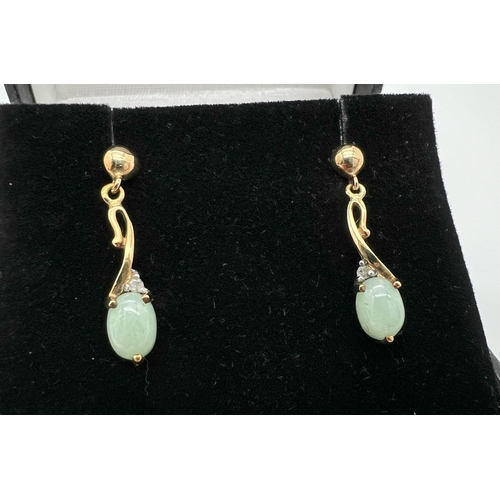 1005 - A boxed pair of 9ct gold green jade and diamond drop style earrings, no butterfly backs. Each earrin... 
