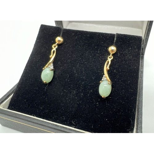 1005 - A boxed pair of 9ct gold green jade and diamond drop style earrings, no butterfly backs. Each earrin... 
