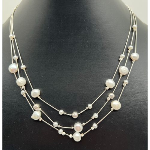 1019 - A 17 inch triple strand silver box chain, bead and freshwater pearl necklace with lobster clasp and ... 
