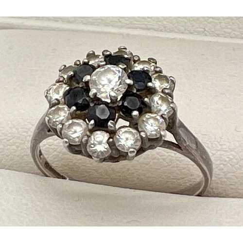 1028 - A vintage silver, sapphire and cubic zirconia cluster dress ring. Hallmarked and stamped CZ inside b... 