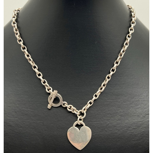 1029 - A 925 silver chunky belcher chain necklace with T bar clasp and heart shaped tag pendant. Chain appr... 