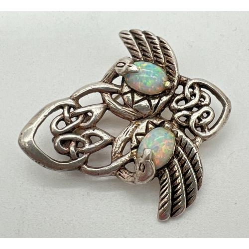 1045 - A 925 silver Art Nouveau design brooch with pierced work detail, set with opals. Approx. 3.5cm long.