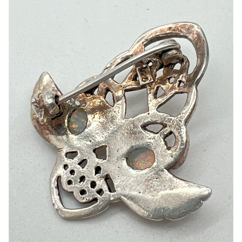 1045 - A 925 silver Art Nouveau design brooch with pierced work detail, set with opals. Approx. 3.5cm long.