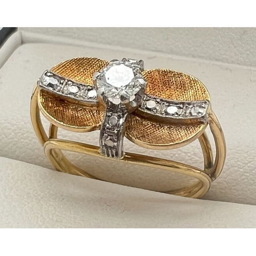 1046 - A bespoke made contemporary design yellow gold dress ring with white gold illusion cross over bands ... 