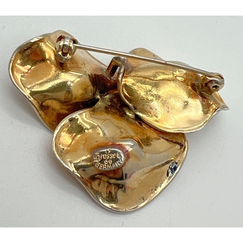 1062 - A vintage 1966 Grosse, Germany gold plated brooch. In the shape of 3 water lily flowers, 2 set with ... 