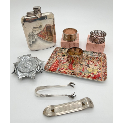 1296 - A small collection of mixed items to include a silver napkin ring with engine turned decoration, an ... 