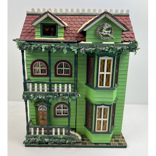 1297 - A Compton & Woodhouse battery operated 'Musical Dolls House' with lights and sounds. Lights up, figu... 