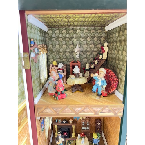 1297 - A Compton & Woodhouse battery operated 'Musical Dolls House' with lights and sounds. Lights up, figu... 