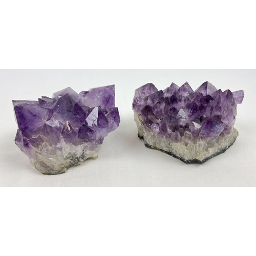 2 natural amethyst clusters with varying sized points to each. Largest approx. 10 x 14cm.