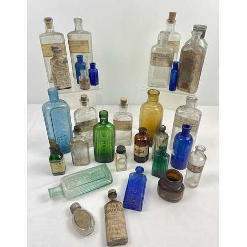 1314 - A quantity of vintage medicine and tincture bottles in various sizes and colours. To include amber, ... 