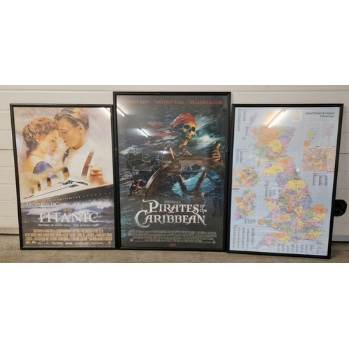 1346 - 2 framed & glazed movie posters to include Titanic and Pirates of the Caribbean together with a Grea... 