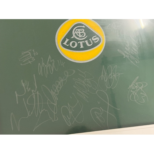 1288 - A framed and glazed signed 2004-05 Norwich City Football Club Xara training shirt with Lotus sponsor... 