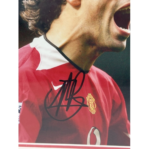 1291 - A framed and glazed signed photograph of Manchester United footballer Ruud Van Nistelrooy, complete ... 