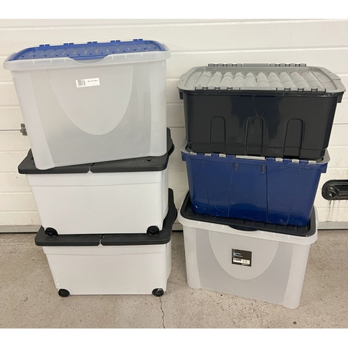 1323 - 6 large plastic storage tubs with lids, to include 2 with wheels. Largest approx. 40cm deep.