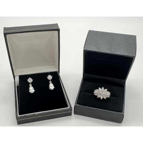1030 - 2 items of silver clear stone set jewellery. A pair of drop earrings each set with a teardrop cut wh... 