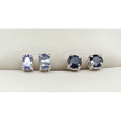 1040 - 2 pairs of silver gem set stud earrings with butterfly backs. A pair of square shaped amethyst earri... 