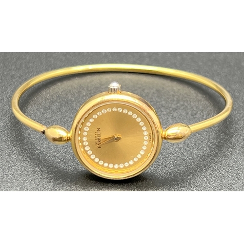 1166 - A ladies gold plated bangle quartz wristwatch by Michael Heberlin, Paris. Brushed gold face set with... 