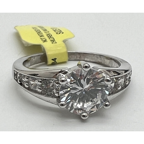 1057 - A Swarovski Crystals rhodium plated cocktail ring, new with tag. Central round cut clear stone with ... 