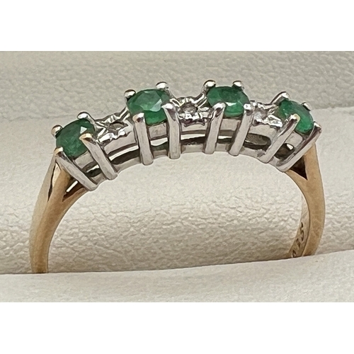 1003 - A 9ct gold, emerald and diamond half eternity ring. Alternating small round cut emeralds and illusio... 