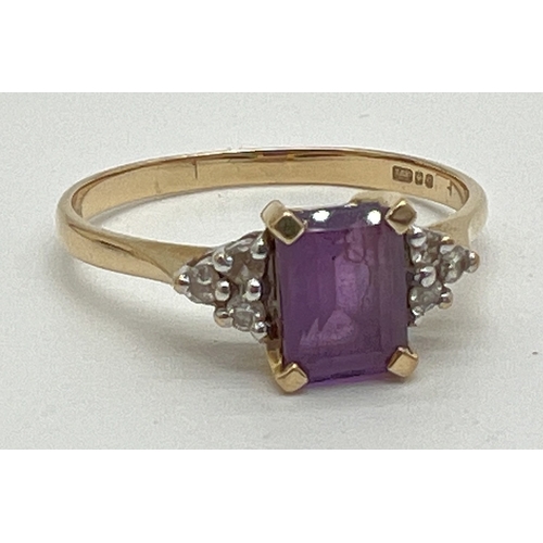 1058 - An 18ct gold amethyst and diamond ring with central emerald cut amethyst and 3 small round cut diamo... 