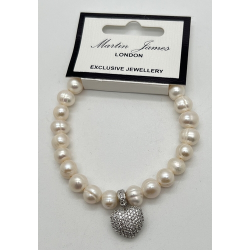 1064 - A freshwater pearl stretch bracelet with dangle heart charm by Martin James, London, new with tags. ... 