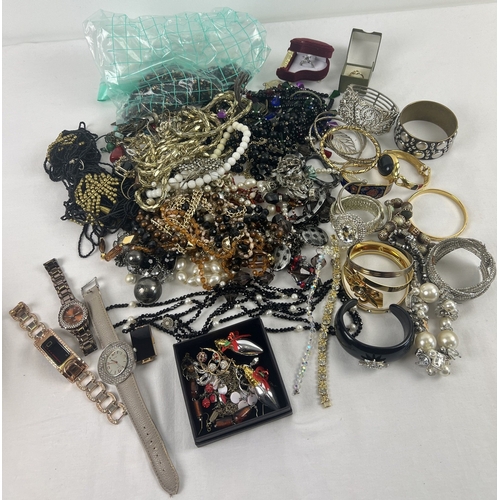 1079 - A quantity of modern and vintage costume jewellery and ladies watches. To include bracelets, bangles... 