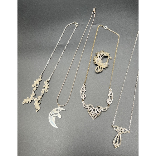 1080 - A collection of vintage marcasite set jewellery together with a silver man-in-the-moon pendant on a ... 