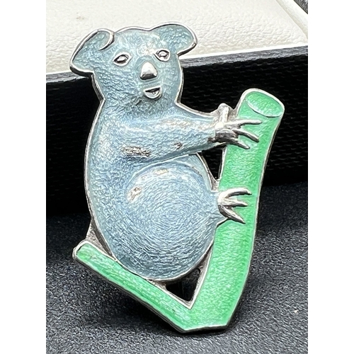 1089 - A vintage silver Koala Bear brooch with blue & green coloured enamel detail. Stamped silver to rever... 