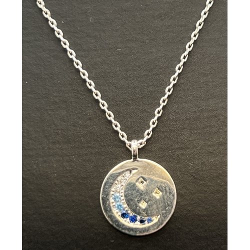 1164 - An Estella Bartlett Moon & Stars pendant necklace set with blue & clear coloured gemstones. 16