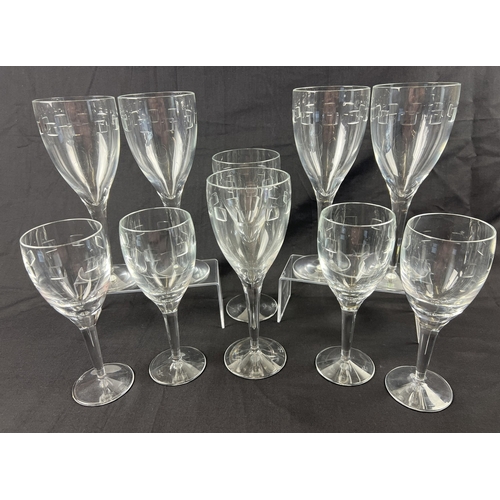 A collection of John Rocha Waterford crystal wine glasses in contemporary design "Geo" pattern. 6 large stemmed glasses (approx. 25cm tall x 9cm diameter bowl), together with 4 smaller wine glasses (approx. 21cm tall x 8cm diameter bowl).