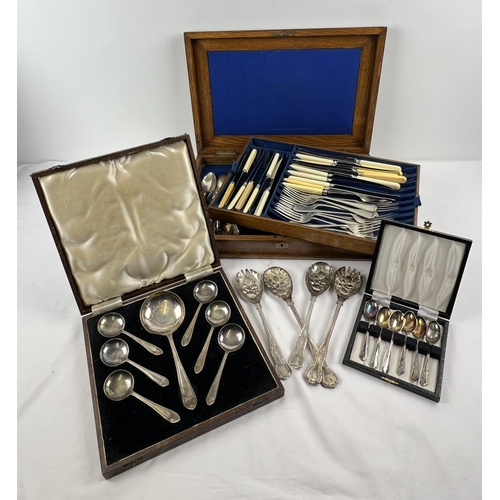 1200 - A wooden cutlery canteen of assorted vintage cutlery together with 2 cased cutlery sets and 2 pairs ... 