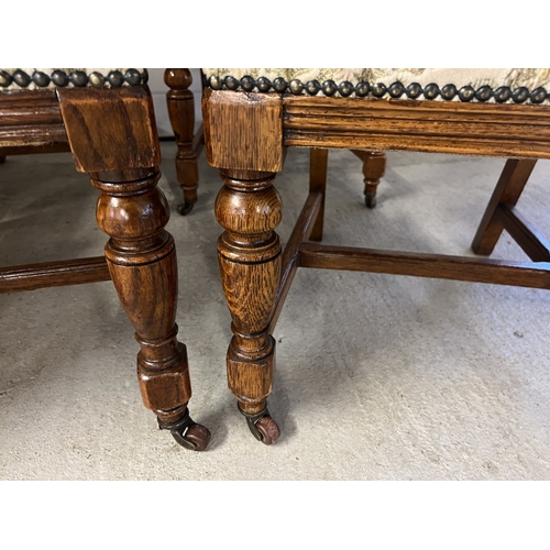 1365 - A set of 6 early 20th century carve backed dining chairs, with original caster front feet and turned... 