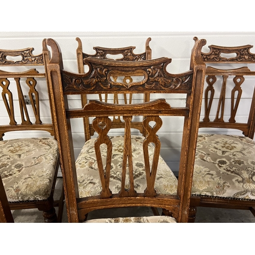 1365 - A set of 6 early 20th century carve backed dining chairs, with original caster front feet and turned... 