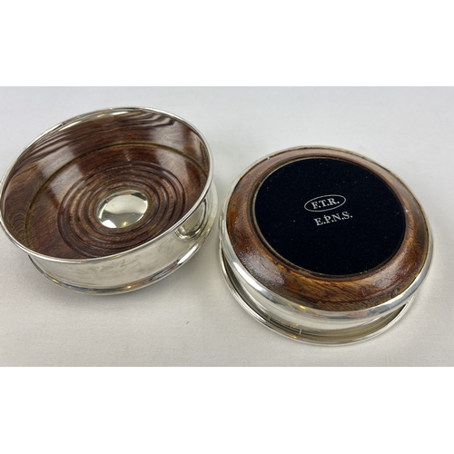 1186 - 2 modern silver plated wine coasters with dark wood bases and green baize to underside. Each approx.... 