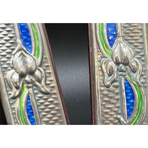 1187 - A pair of Art Nouveau design silver fronted photo frames with green & blue enamelled detail. Each st... 