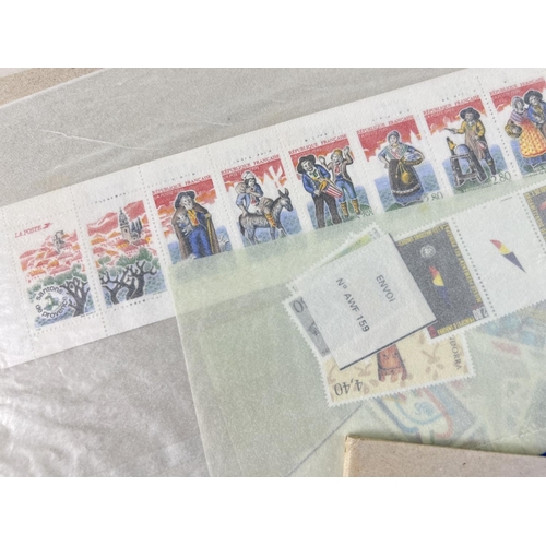 163 - A collection of 1990's La Poste French postage stamps, in mint condition, with original invoices & p... 