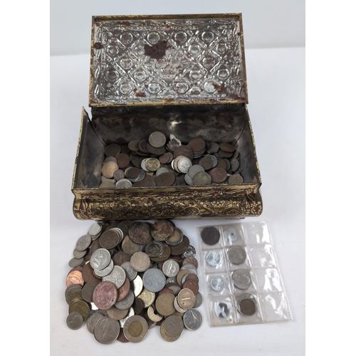 14 - A vintage tin containing a collection of British and foreign coins. To include examples from, Americ... 