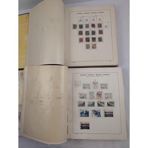 113 - 2 Schaubek Danmark stamp albums containing a quantity of Danish stamps in various conditions. Albums... 