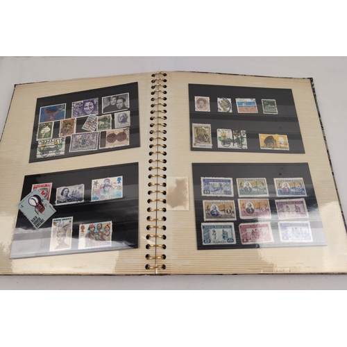 123 - 2 stamp albums. A red collectors stock book containing a collection of various German stamps to incl... 