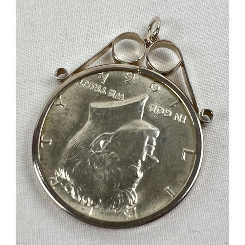 47 - A 1964 Kennedy 90% silver half dollar coin in a decorative silver pendant mount. Total weight includ... 