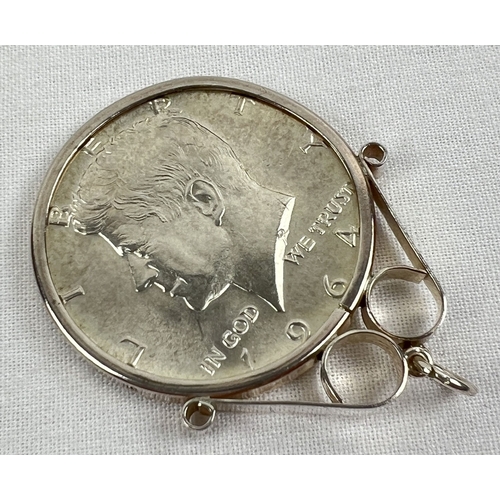 47 - A 1964 Kennedy 90% silver half dollar coin in a decorative silver pendant mount. Total weight includ... 