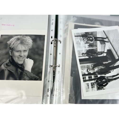 220 - A folder containing 70 professional black & white and Colour photographs of Actors, Musicians and Co... 